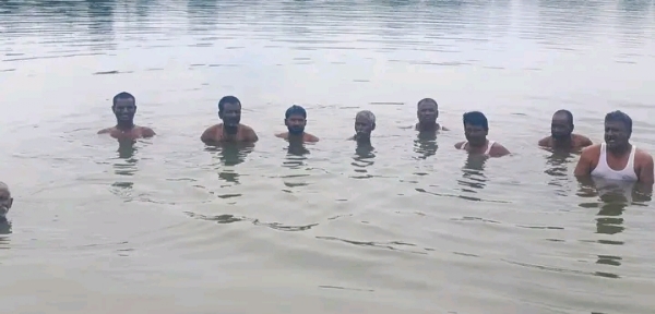 अ