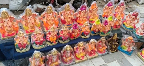 अ