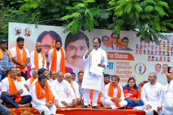 अ