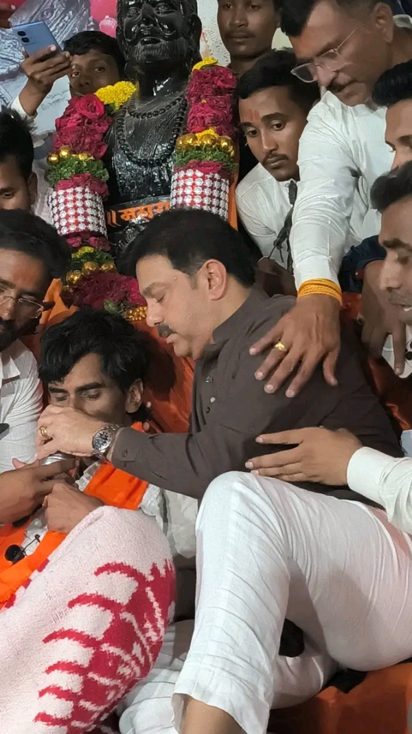 अ