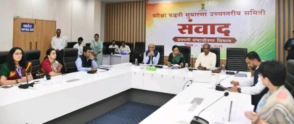 अ