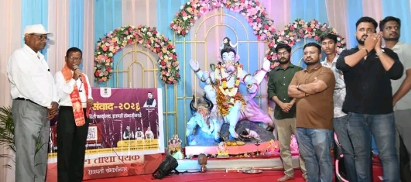 अ