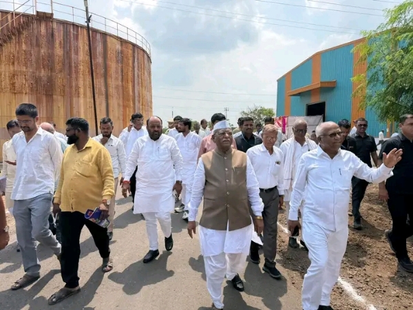 अ