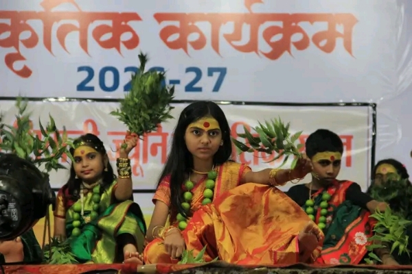 अ