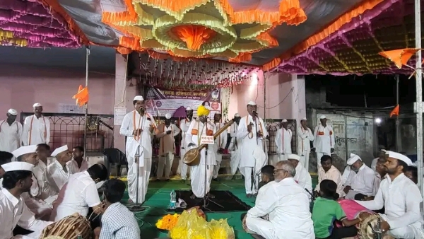 अ