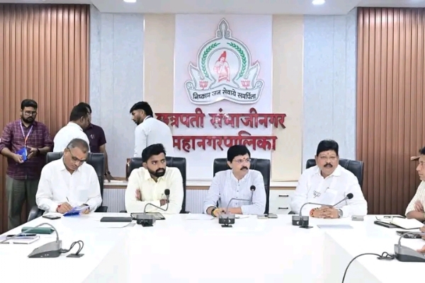 अ