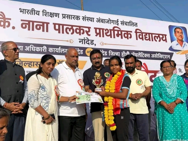अ